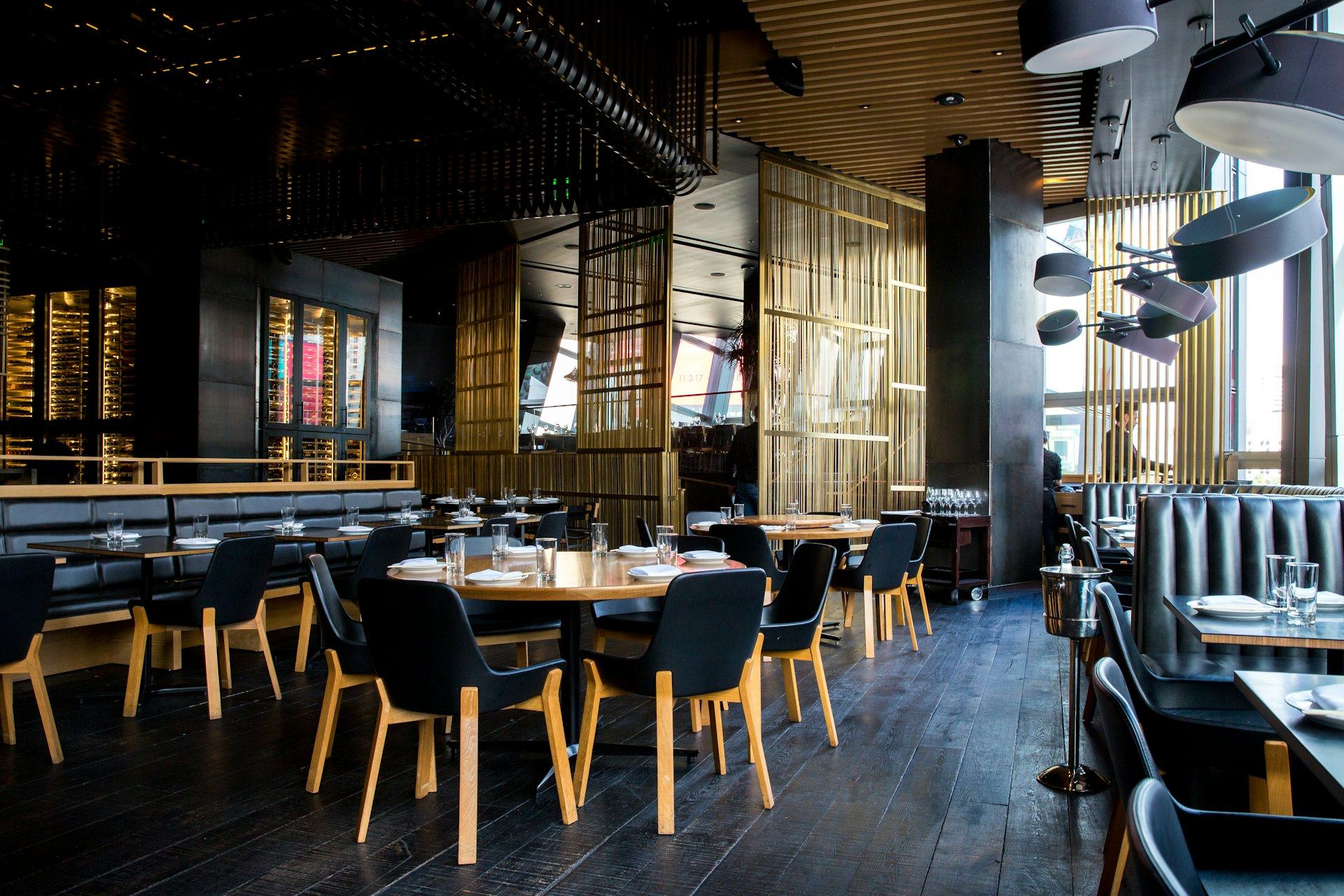 Warm, dimly lit interior of Rasa with string lights and wood tones